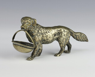 A silver plated figure of a standing dog holding a basket in its mouth 14.5cm 