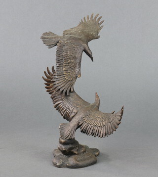 Franklin Mint, after Ronald Van Ruyckevelt, a bronze figure group "Guardians of The Sky" study of 2 eagles in flight 24cm h x 27cm w x 8cm d 