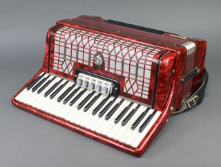A German Galotta "Ideal" piano accordion, 120 bass, 41 keys, 3 reeds and 5 couplers, complete with 2 shoulder straps 