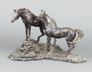 Franklin Mint, after Lanford Monroe, a bronze figure group "Intruders" study of 2 horses on a rocky outcrop 19cm x 28cm x 14cm 