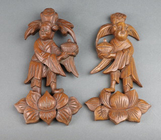 A pair of Chinese carved and pierced hardwood plaques depicting figures 23cm x 12cm 