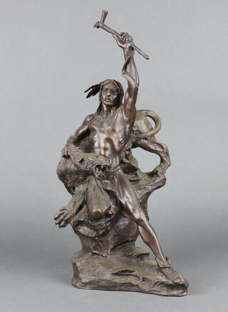 Franklin Mint, after Buck McCain, a bronze figure of a standing Native Indian warrior with big cat, raised on a rocky outcrop, indistinctly signed and marked TFM 40cm x 24cm x 13cm 