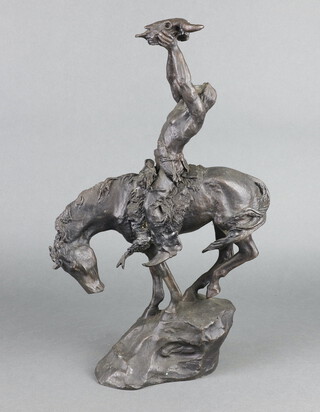 Franklin Mint, after Buck McCain, a bronze figure of a Native Indian horseman with buffalo skull 43cm x 20cm x 7cm 