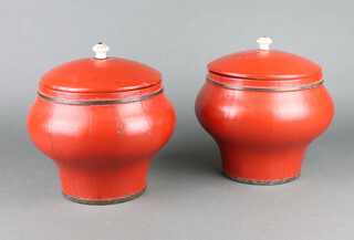A pair of 19th/20th Century red lacquered jars and covers 20cm x 19cm 