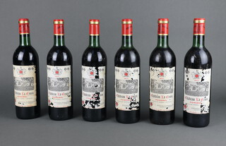 Six bottles of 1971 Chateau La Croix Pomerol red wine (on one bottle the level is just under the shoulder, the labels are damaged in places)  
