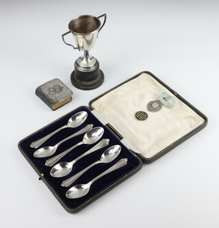 A cased set of 6 silver teaspoons Birmingham 1915, a silver trophy cup, a silver mounted Reynolds angels book of common prayer, a sports medallion, weighable silver 152 grams 