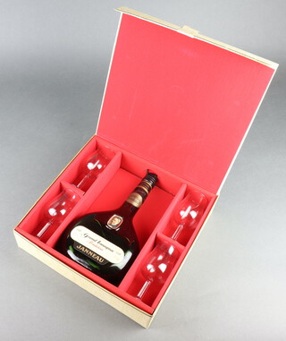 A 1970's bottle of Janneau Grand Armagnac contained in a presentation box with 4 glasses