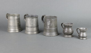 An 18th/19th Century pewter pint tankard marked TV Doile Tower Inn Ripe, 1 other marked with a Crown XX, James Yates a pewter pint tankard (some corrosion and dents), a quarter baluster measure and 1 other