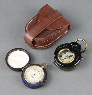A First World War Barker's patent prismatic compass marked J S Pearson RGA, contained in a leather case (compass is not moving), together with a Nigretti & Zander pocket barometer, the dial marked Nigretti & Zander London 14967 contained in a leather case (in working order, the needle moves when under pressure) 3cm 