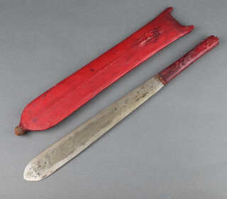 A Malaysian Mau Mau dagger with 28cm blade in red scabbard 