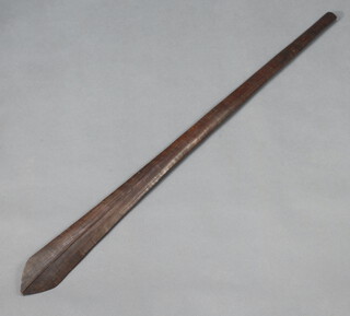 A carved wooden ceremonial paddle of leaf shape 113cm x 9cm 