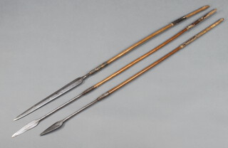A 19th/20th Century double bladed shaped spear with 15cm blade and wooden shaft, 1 other double bladed spear with leaf shaped blade 42cm and 1 other leaf shaped spear marked W Marples & Sons 13cm 