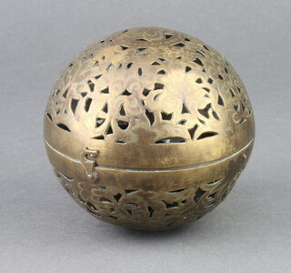 An Eastern pierced brass circular lantern 8cm diam.
