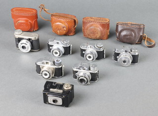 A Coronet miniature camera contained in a black Bakelite case and 6 others comprising 2 Crystar, a Petie, a Hit, a Minetta and a Mycro 20mm camera with associated cases  