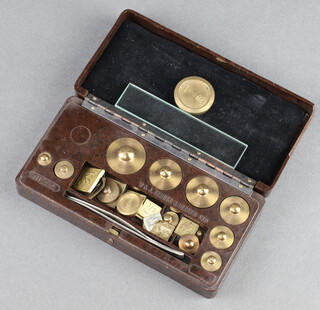 33 various metal scientific weights contained in a rectangular brown Bakelite W & J George Becker Ltd case 