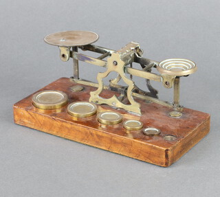 A pair of 19th Century brass letter scales complete with 5 weights (1 missing) 
