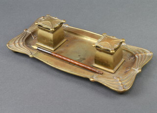 An Art Nouveau gilt metal twin bottle ink stand incorporating a tray, raised on bun feet, base marked RD143554 together with a dip pen 9cm h x 28cm w x 14cm d  