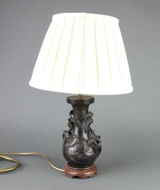 A Japanese bronze vase converted to a table lamp raised on a hardwood base 23cm h x 11cm 