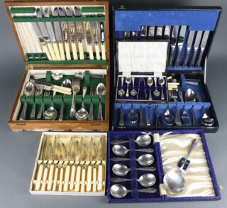 Four cased sets of silver plated cutlery together with a chromium plated canteen of flatware contained in an oak box
