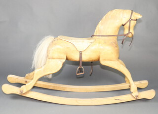 A carved pine rocking horse 97cm h x 153cm x 32cm 