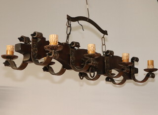 A rustic pine and wrought iron 8 light electrolier 18cm x 101cm x 35cm 