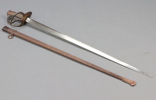 A 19th Century French Cuirassier sword dated 1886, complete with scabbard