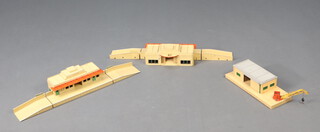 Two Hornby Dublo stations together with a plastic platform and train, all un boxed