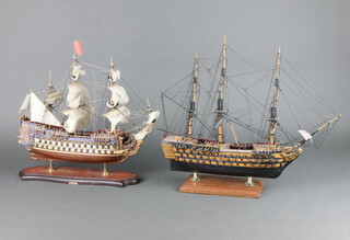 A wooden model of a 3 masted galleon 26cm x 38cm x 9cm and 1 other 