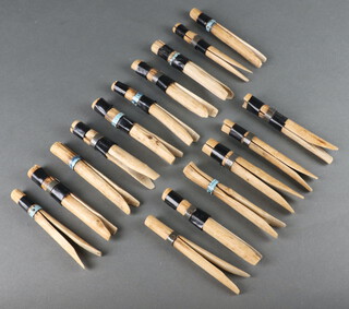 Sixteen 1920's wooden clothes pegs 