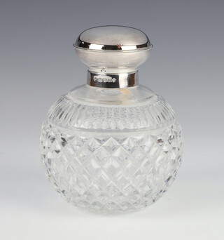 A cut glass silver mounted spherical toilet bottle and stopper, silver lid Sheffield 2000 12cm  