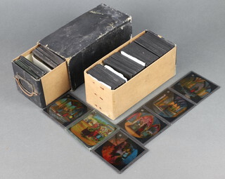 A box of black and white photographic magic lantern slides and some coloured slides depicting the tale of Aladdin, approx 80 in total.