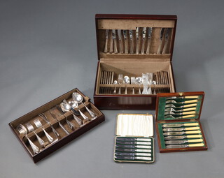 A silver plated canteen of cutlery for 12, contained in a stained case, 128 pieces, 2 cased canteens 
