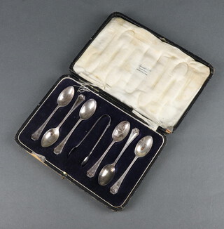 A set of 6 silver coffee spoons and nips London 1915, 84 grams, cased 