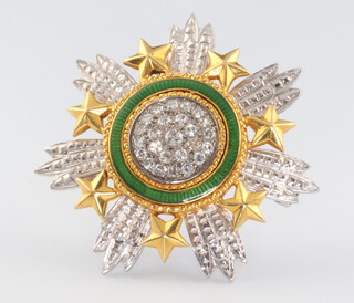An 18ct white gold yellow metal diamond and green guilloche enamel brooch in the form of The Star of Jordan, 34mm, 17.9 grams, maker Garrard & Co, contained in a fitted box 