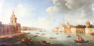 20th Century oil on canvas unsigned, extensive view of the Grand Canal Venice 49cm x 100cm, contained in an ebonised and gilt frame 