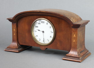An Art Nouveau Swiss bedroom timepiece with enamelled dial and Arabic numerals, contained in an arch shaped inlaid case 15cm h x 30cm w x 9cm d 
