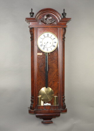 A Vienna style striking regulator, the 18cm enamelled dial with Roman numerals, contained in a carved walnut case, complete with pendulum, weights and key 112cm h x 41cm w x 20cm d 