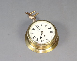 F W Elliott, an Elizabeth II ward room style timepiece, the 14cm dial with Roman numerals, subsidiary second hand and screw off bezel, the base marked 1956 ER Made by F W Elliott Ltd, Croydon 