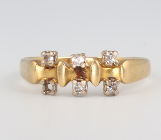 A yellow metal 18ct (five ex six) stone diamond ring 3.5 grams, size T 