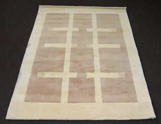 A contemporary white ground Indian wool rug with geometric designs 239cm x 172cm 