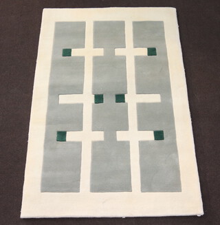 A contemporary Indian wool, white, grey and green ground rug 189cm x 121cm 