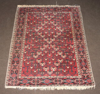 A blue and white ground Persian rug with all over geometric design within multi row borders 188cm x 142cm 