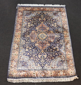 A North West Persian blue and white ground silk rug with central medallion 182cm x 123cm 