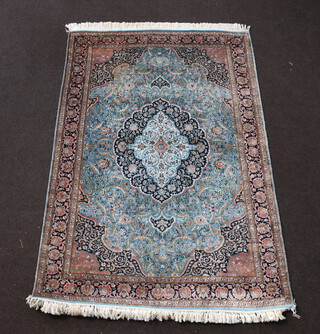 A North West Persian green and brown ground silk rug with central medallion 187cm x 122cm 