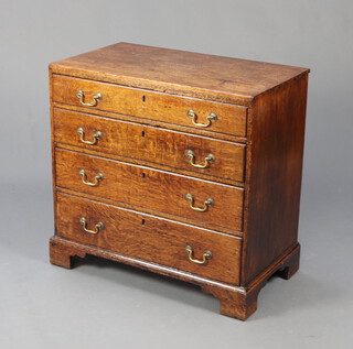 An 18th Century oak chest of 4 long drawers with replacement brass swan neck drop handles, raised on bracket feet 79cm h x 81cm w x 46cm d 