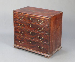 A Georgian mahogany chest fitted a brushing slide above 3 drawers, raised on a platform base with brass swan neck drop handles 75cm h x 77cm w x 47cm d 