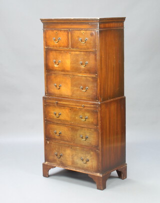 A 1930's Georgian style mahogany chest on chest with moulded cornice, fitted 2 short and 3 long drawers above a brushing slide and 3 long drawers, raised on bracket feet 149cm h x 66cm w x 41cm d 