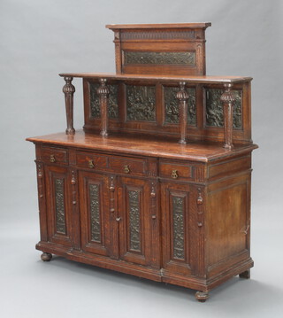 A 19th Century oak and embossed metal dresser, the raised back fitted 4 embossed copper panels decorated tavern scenes above 4 short drawers, the base fitted a cupboard enclosed by embossed copper panels, decorated urns, raised on bun feet 155cm h x 142cm w x 55cm d 
