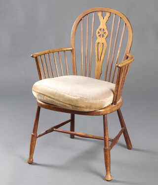 A beech framed Windsor stick and wheel back armchair with woven cane seat raised on turned supports with H framed stretcher 81cm h x 53cm w x 42cm d (seat 28cm x 27cm) 