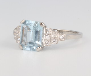 A white metal stamped Plat aquamarine and diamond ring the centre cut stone approx. 1.7ct, the 12 brilliant cut diamonds 0.2ct, 3.9 grams, size O 